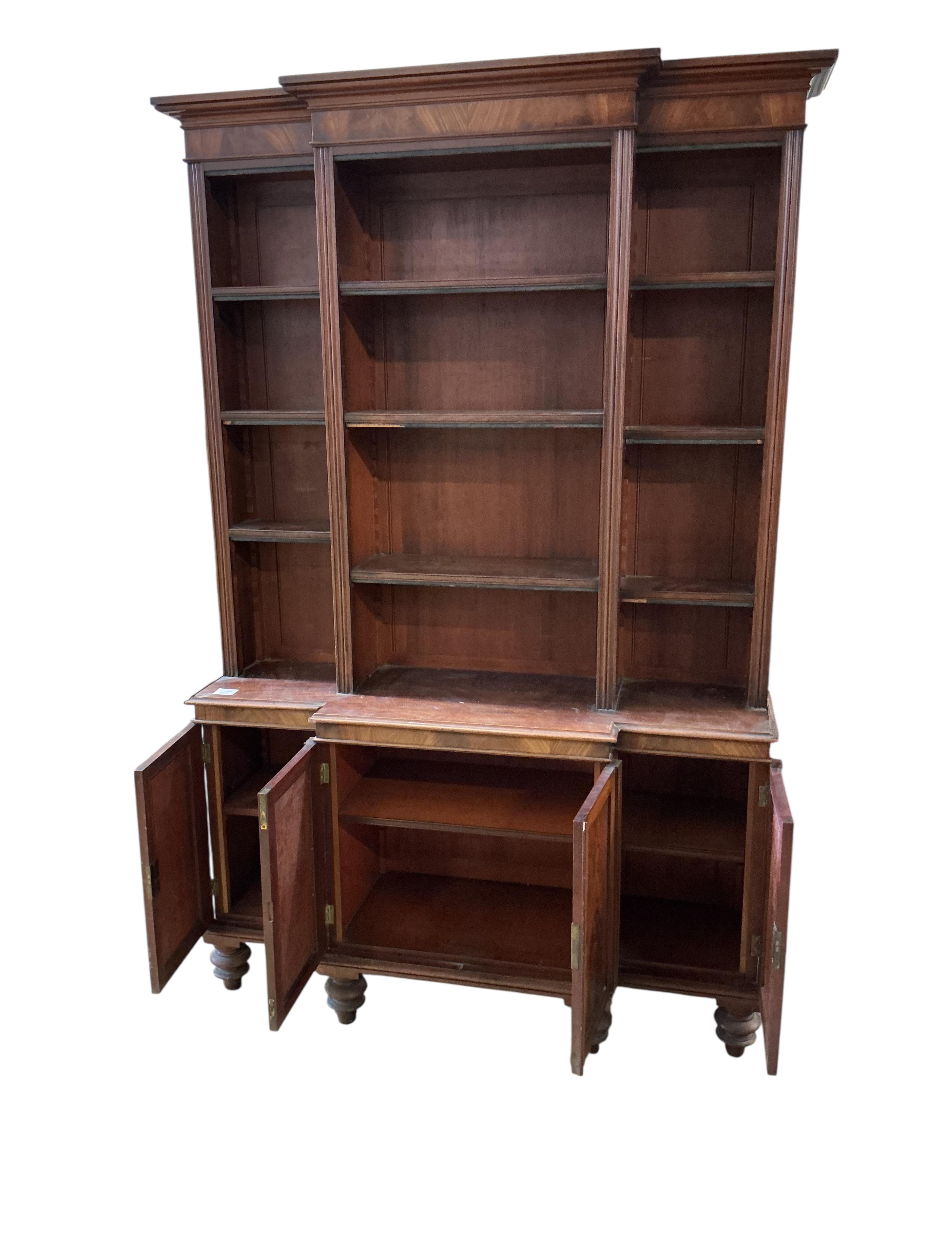 A small George IV style mahogany breakfront bookcase / cupboard, width 110cm, depth 30cm, height 172cm